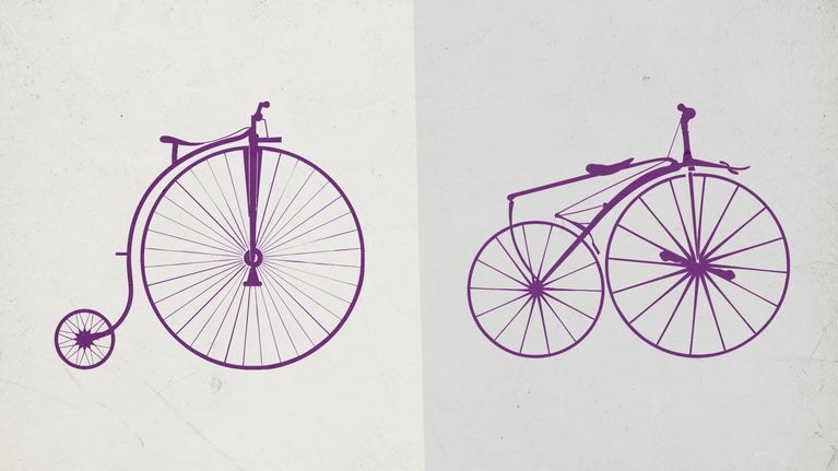 A pennyfarthing and a boneshaker bicycle